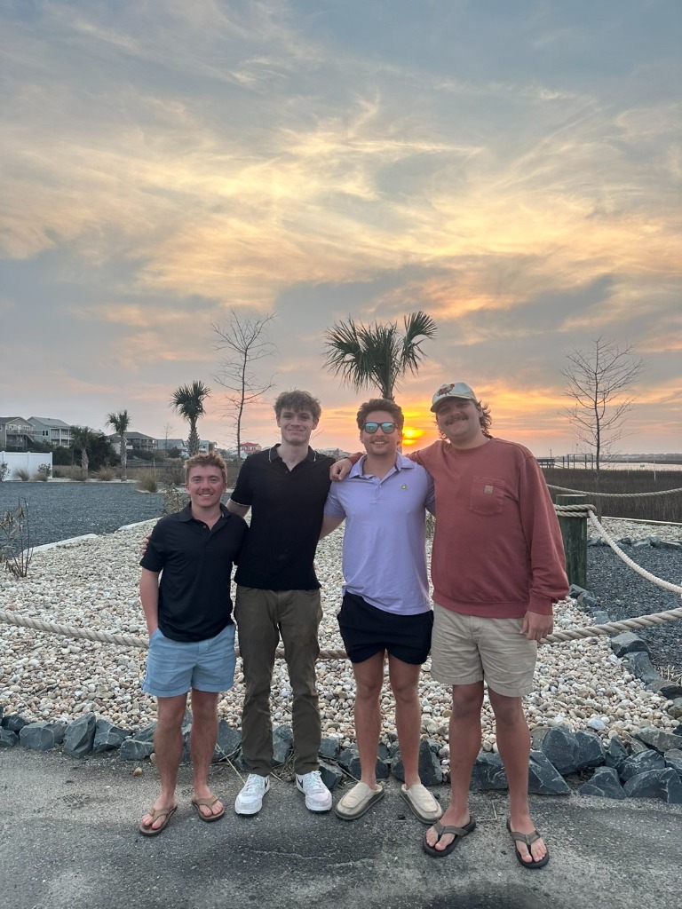 Ben Sachwitz with friends at coastal sunset