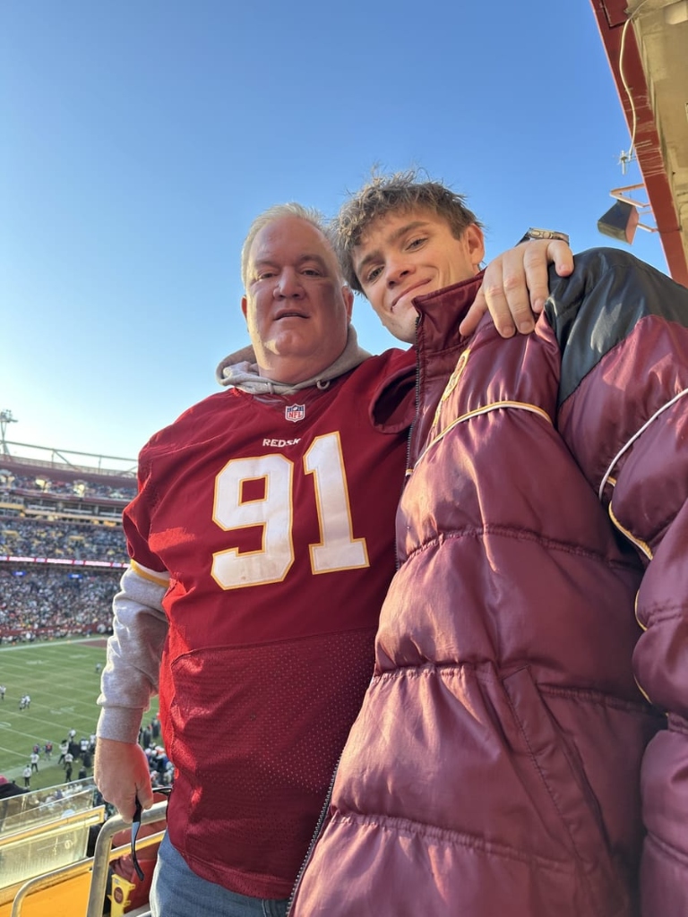 Ben Sachwitz with his father at football game