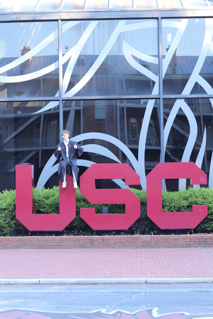 Ben on USC sign